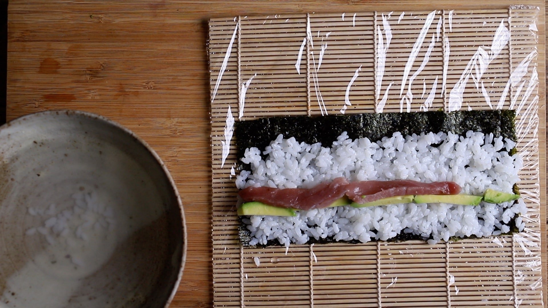 Add your fish and vegatable strips to the top of the rice