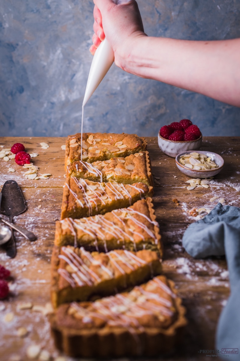 Adding icing sugar to bakewell slices