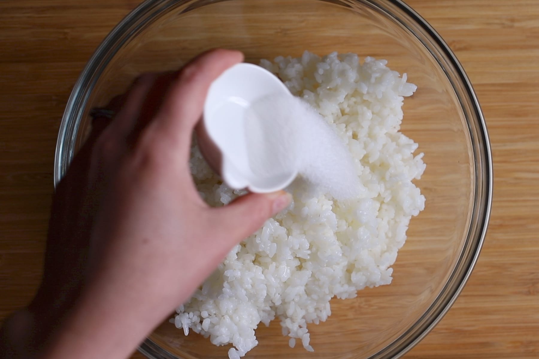 adding sugar to rice