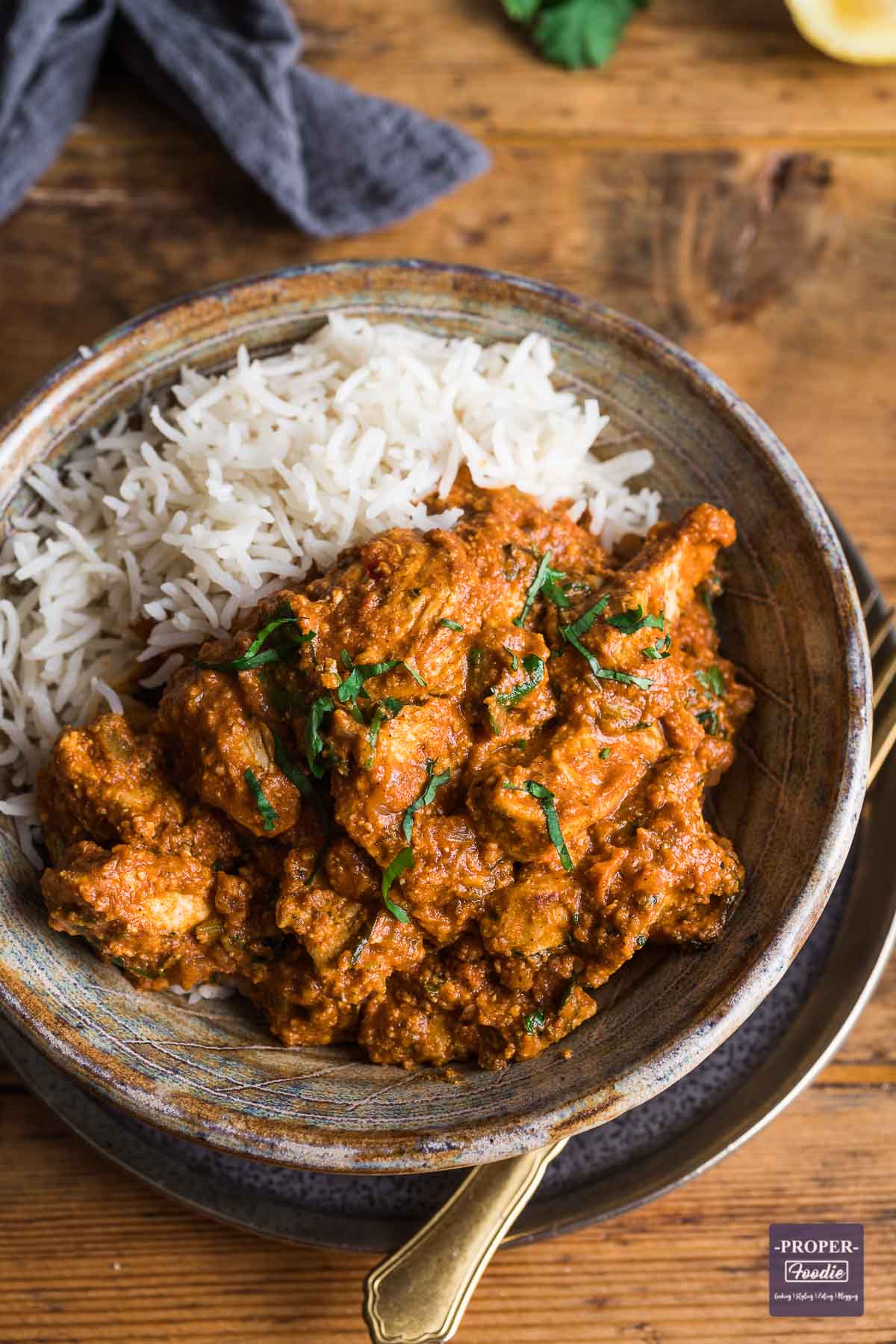 Chicken tikka masala curry in a bowl with rice.