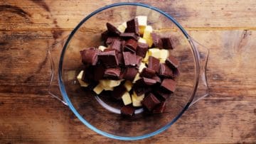 cubed butter and cooking chocolate in a bowl