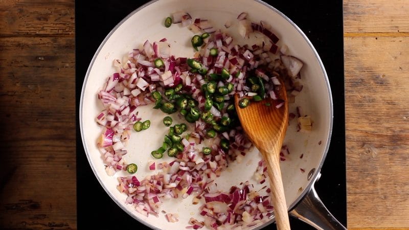 fry cumin seeds, onion and green pepper