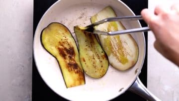 frying aubergine slices