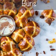 Easter hot cross buns tear and share with milk and white chocolate sauce dip