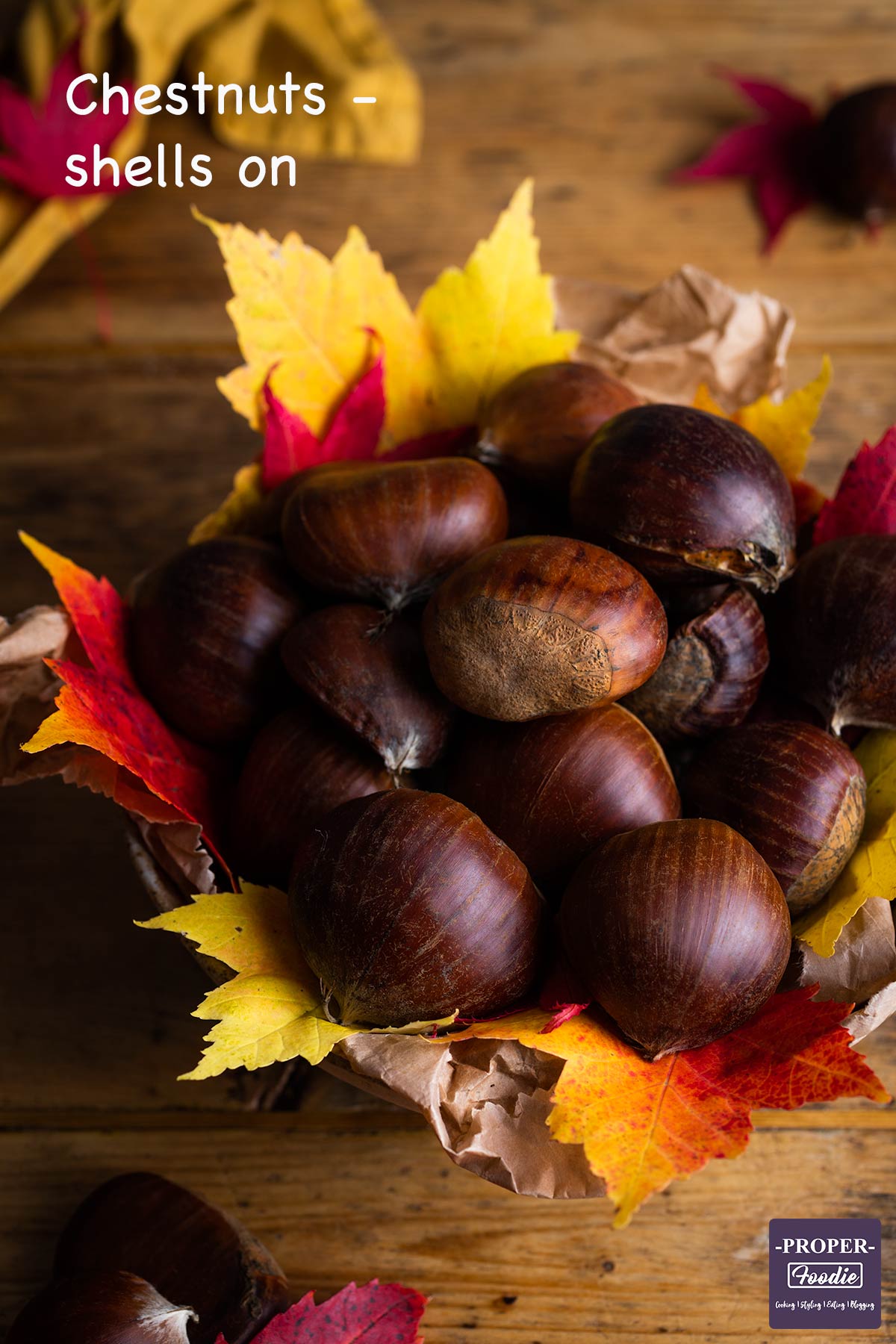 Ingredients for roast chestnuts: Bowl of chestnuts with shells on.