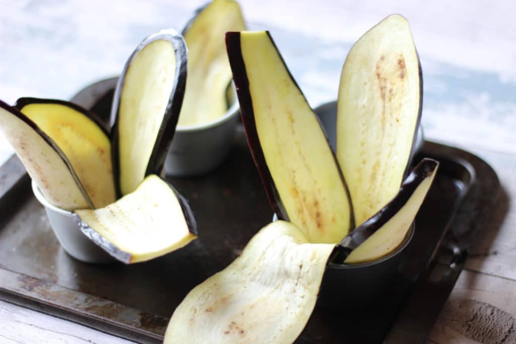 line tins with aubergine slices