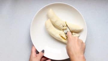 Mash bananas with a fork