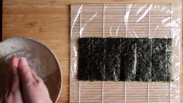 nori sheet in centre of bamboo mat