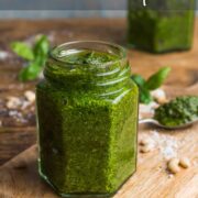 Small jar filled with basil pest and text overlay saying: Pesto Recipe