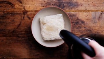 pouring hot water over uncooked noodles