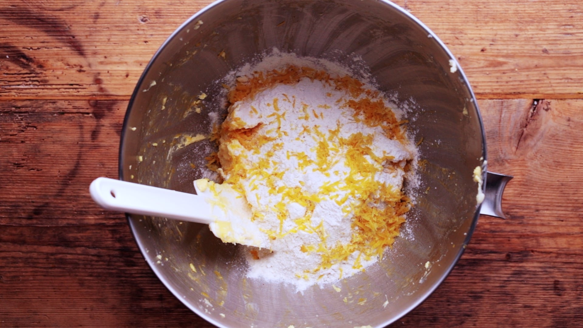 Self raising flour and lemon zest added to cake mixture