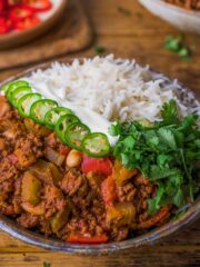 chilli con carne in a bowl with cannellini beans and rice.