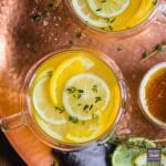 Honey and lemon tea in a glass tea cup viewed from above.