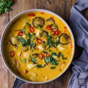 A large pan of Thai red curry with tender chunks of chicken and oven roasted veggies.