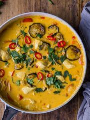 A large pan of Thai red curry with tender chunks of chicken and oven roasted veggies.