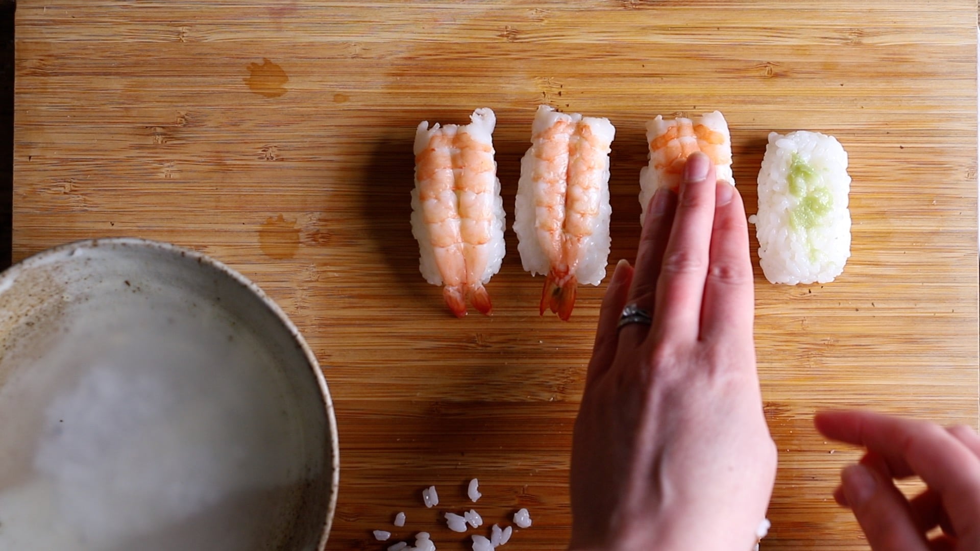 stick cooked butterflied king prawns on each nigiri rice ball