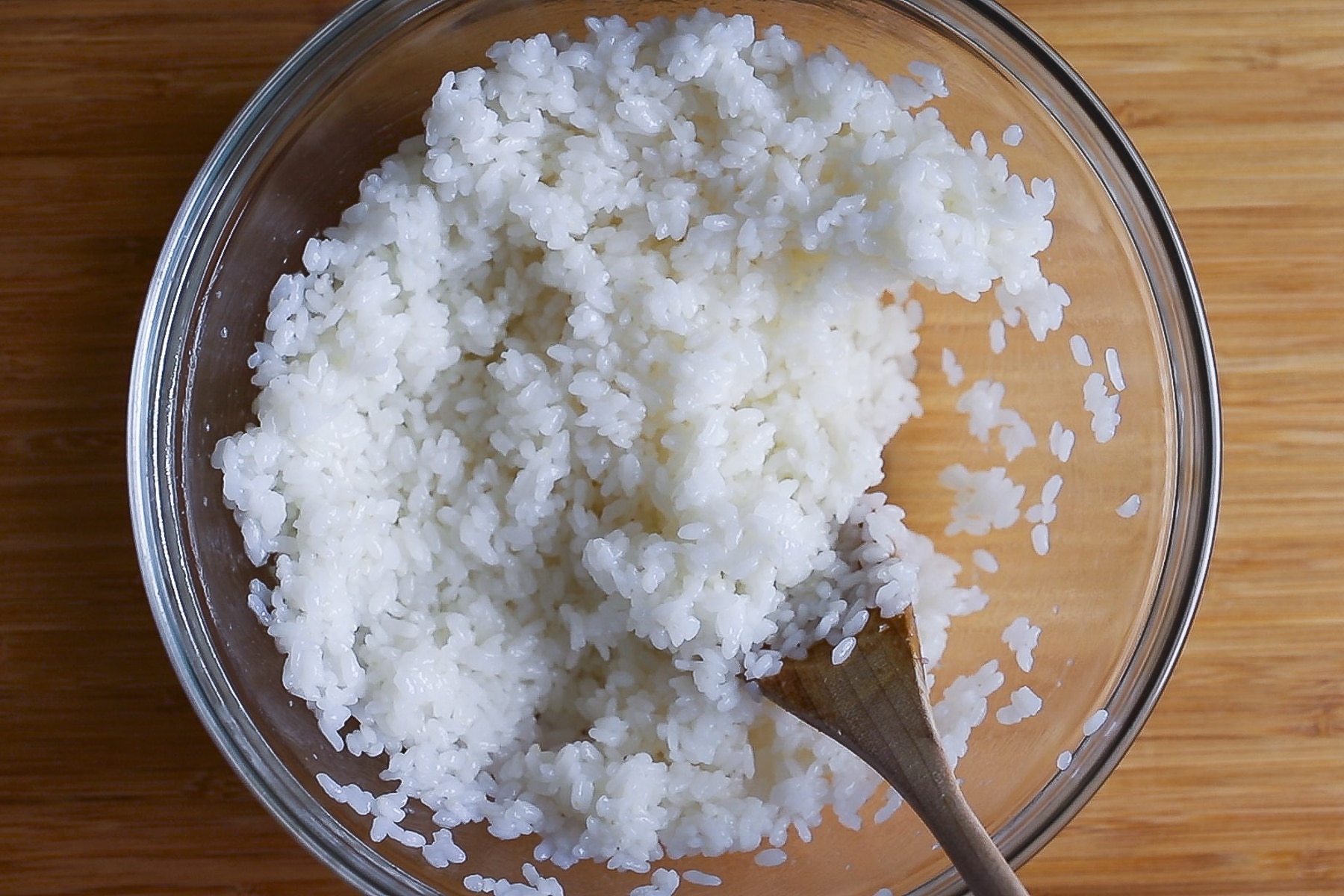 Sushi rice in a bowl with mirin, rice wine and sugar added