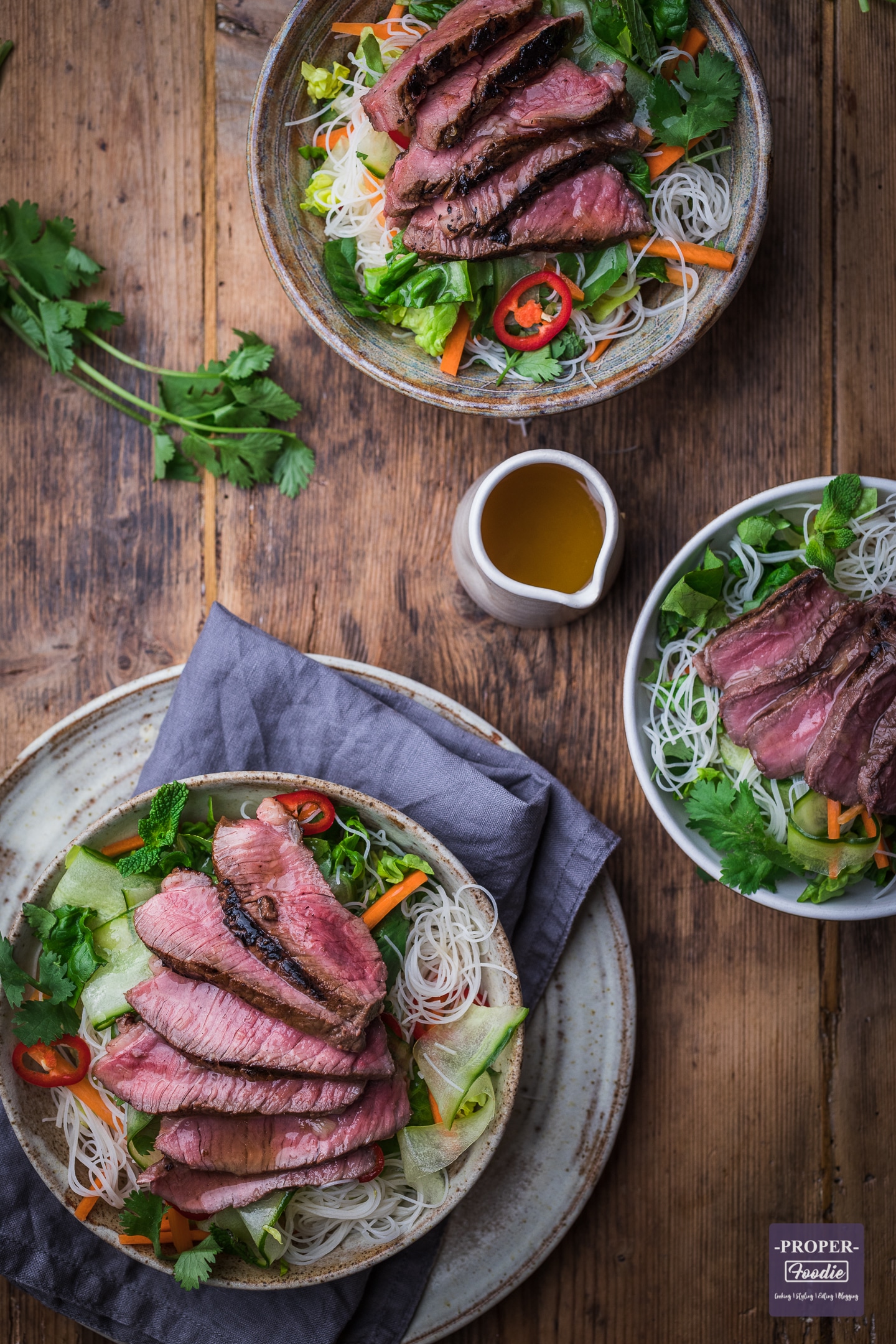 Vietnamese style noodle salad recipe wth sliced steak served up in 2 bowls