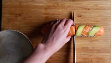 wet knife and slice the dragon roll into 6, with or without cling film on